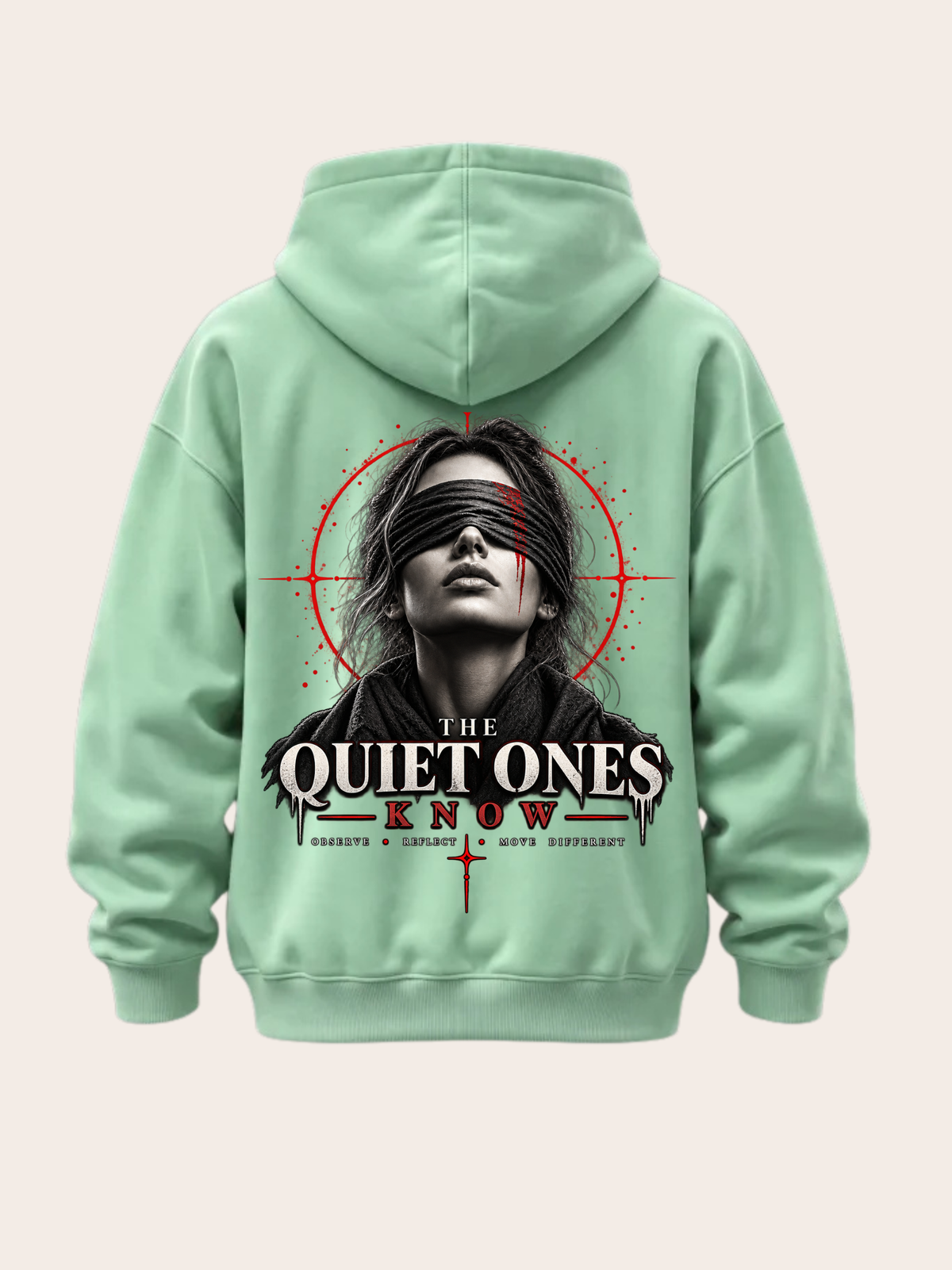 Mintgrüner Oversized Hoodie mit großem THE QUIET ONES KNOW Rückenprint, Frauenporträt mit schwarzer Augenbinde sowie roten und schwarzen grafischen Elementen.