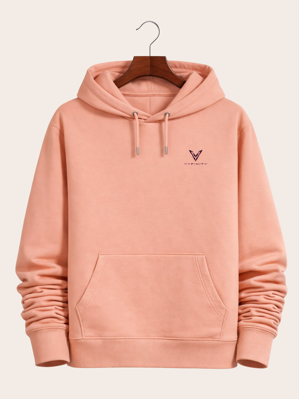 Vyfinity Control The Noise Hoodie – Peach – 350 GSM – Frontansicht am Holzkleiderbügel mit kleinem Vyfinity Brustlogo