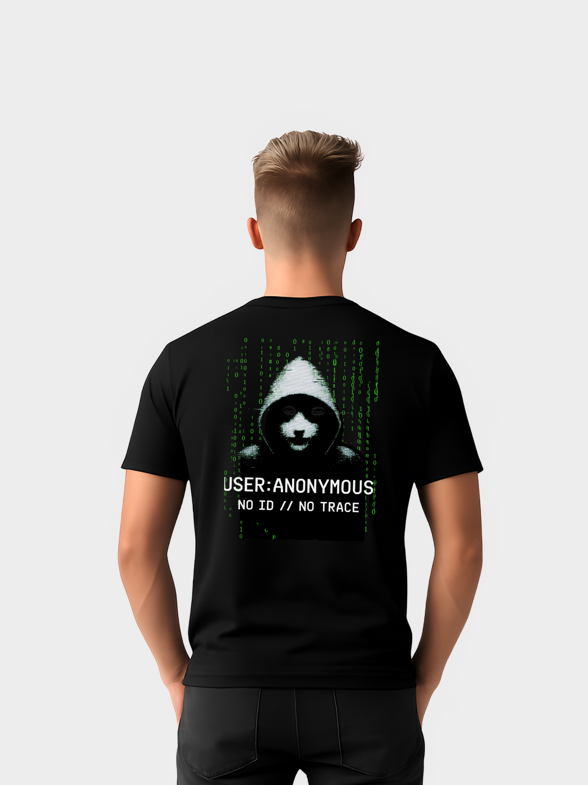 Schwarzes T-Shirt mit großem Backprint im Hacker-Style: eine Guy-Fawkes-Maske im Kapuzenpullover, umgeben von grünem Matrix-Code. Darunter der Schriftzug „USER: ANONYMOUS – NO ID // NO TRACE“. Ein starkes Cyberpunk- und Hacktivismus-Design für Streetwear und digitale Rebellion.