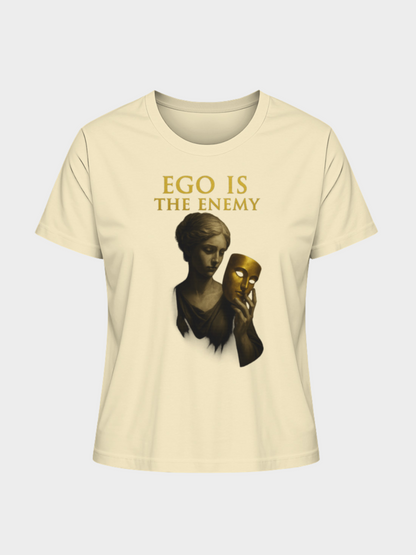 Beiges T-Shirt mit goldener Aufschrift „EGO IS THE ENEMY“ und künstlerischem Motiv einer Frau, die eine goldene Maske in der Hand hält. Modernes Statement-Shirt mit tiefgründiger Botschaft.