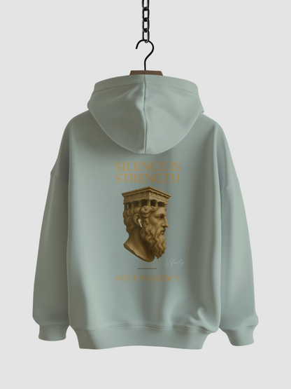 Vyfinity Move in Silency Hoodie in Aloe – Rückseite mit goldener Statue und Claim Silence is Strength