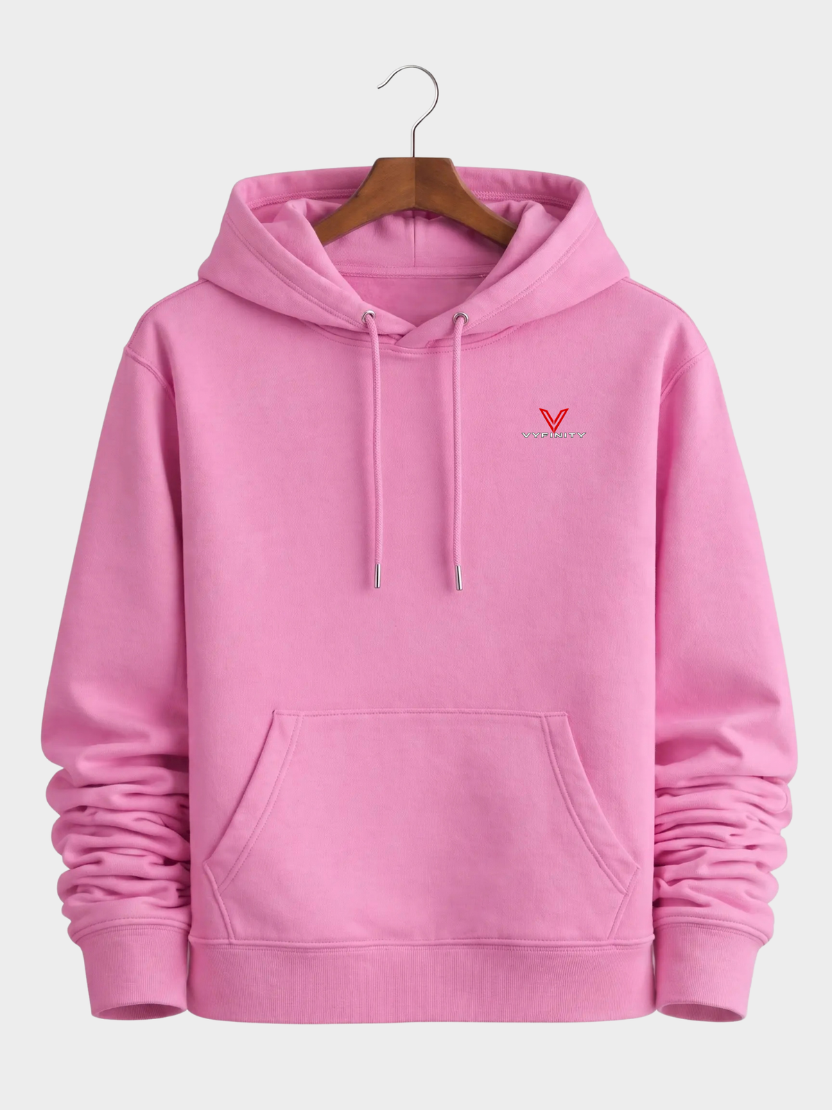 Pinker VYFINITY Not Your Problem Cruiser 2.0 Hoodie 350 GSM auf Holzkleiderbügel mit kleinem VYFINITY Frontlogo