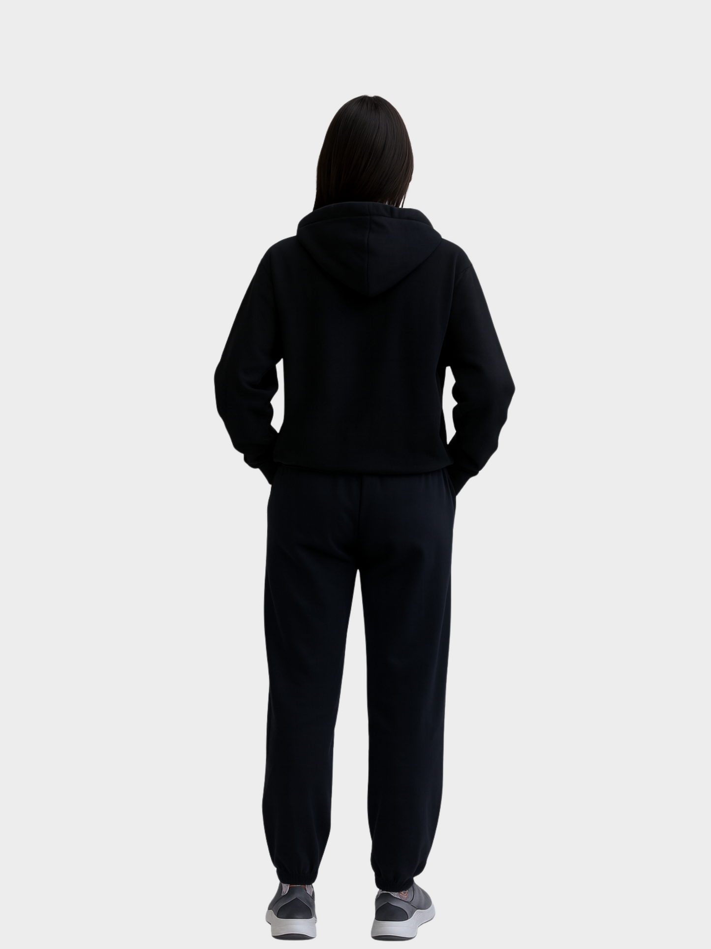 Frau von hinten in schwarzem Vyfinity Pulse Hoodie Elegance Over Noise ohne sichtbares Design